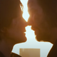 Trinity and Neo leans forward to quite while silhouetted against the sunset.